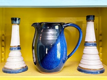 A Ceramic Pitcher And Pair Of Vintage Candlesticks