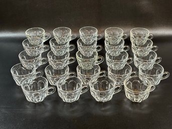 A Large Assortment Of Vintage Punch Cups In Clear Glass