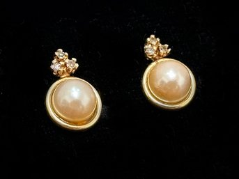 A Pair Of Vintage Pearl Earrings In 14K Gold Settings