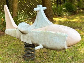 A Vintage Fiberglass Rocket Ship Child's Ride