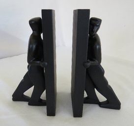 A Pair Of Stone Resin Bookends 'Pushing To The Limit'