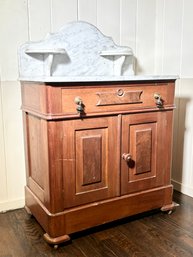 A Late 19th Century Victorian Walnut Marble Top Washstand