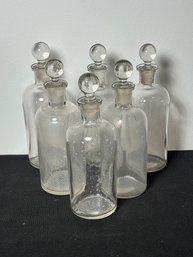 SIX VINTAGE APOTHECARY BOTTLES OR COLOGNES