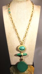 Contemporary Gold Tone Necklace Having Large Green Plastic Stone Pendant