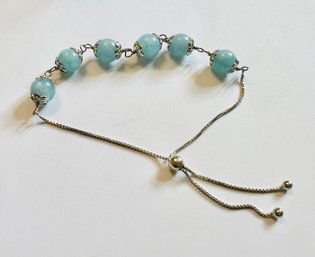 RHODIUM OVER STERLING SILVER BLUE DREAMY AQUA MARINE BOLO BRACELET