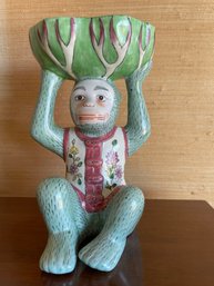 Chinoiserie Hand Painted  Porcelain Monkey Holding A Bowl.  9' Tall