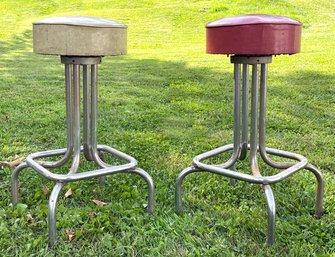 A Pair Of Vintage Bar Stools With Vinyl Seats