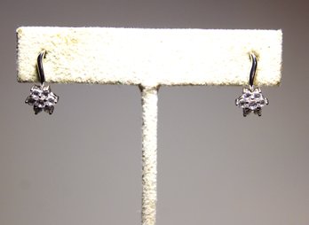 Fine 14K White Gold Pierced Earrings Having White Gemstones