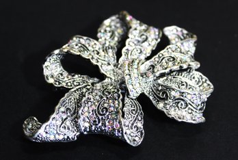 Contemporary Large Silver Tone Bow Shaped Brooch Having Rhinestones