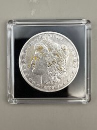 1884 Morgan Silver Dollar In Plastic Case