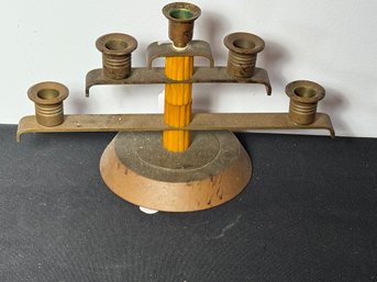 AN ART DECO BRASS AND BAKELITE CANDELABRA