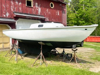 An Ensign Sailboat With Genoa Sails