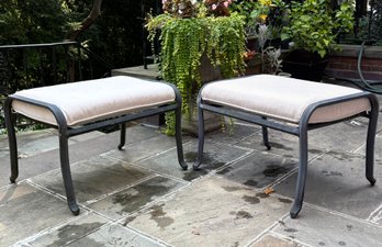 A Pair Of Cast Aluminum Outdoor Ottomans With Linen Cushions