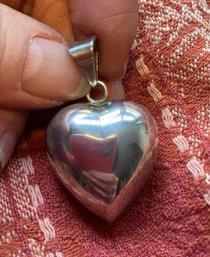 A Large Puffy Heart Pendant With A Subtle Bell Sound - Silver Plated