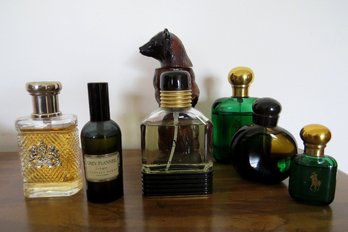 A Grouping Of Men's Cologne Bottles - Opened