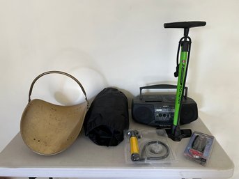 Misc Lot With Brass Firewood Holder, Bike Pump, Blanket, And Radio