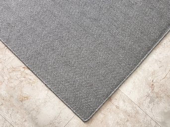 A Modern Grey Sisal Rug By Restoration Hardware