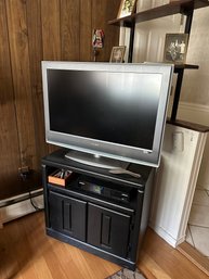 Sony 32' Tv With 2 Door Cabinet On Wheels