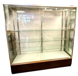 A Glass Sliding Double Door Display Cabinet With Glass Shelves - 1 Of 2