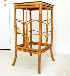 A Vintage Rattan Side Table With Woven Top