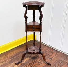 An Antique Mahogany Plant Stand