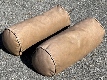 A Pair Of Leather Bolster Pillows