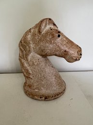 A PAINTED CAST IRON HORSE HEAD DOOR STOP