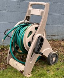 A Garden Hose And Hose Holder