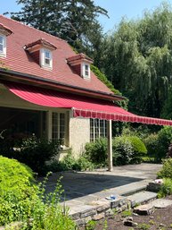 A Red Striped SunSetter Canvas Retractable Awning