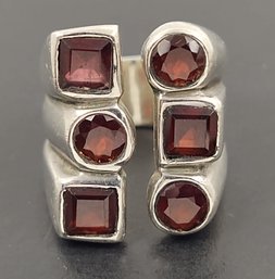 VINTAGE MID CENTURY ABSTRACT STERLING SILVER GARNET RING W/ OPEN FRONT