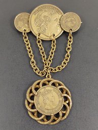 VINTAGE BRASS TONE FOREIGN COINS BROOCH
