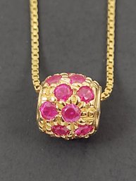 GOLD OVER STERLING SILVER SLIDING RUBY CHARM NECKLACE