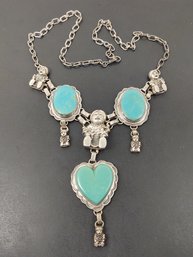ANGLO - NATIVE AMERICAN CAROL FELLEY STERLING SILVER TURQUOISE HEART STORYTELLER NECKLACE