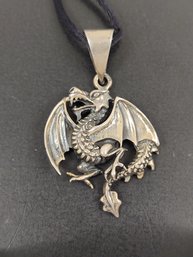 STERLING SILVER DRAGON PENDANT ON SILK NECKLACE