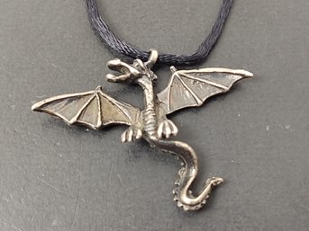 STERLING SILVER FLYING DRAGON PENDANT ON SILK NECKLACE