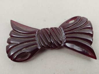 VINTAGE CARVED CHERRY AMBER BAKELITE 2 PIECE BOW BUCKLE