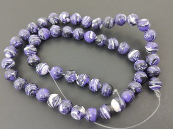 STRAND OF LOOSE ROUND PURPLE TURKEY TURQUOISE BEADS