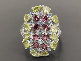 STUNNING STERLING SILVER PERIDOT GARNET AND BLUE TOPAZ DOUBLE FLOWER RING