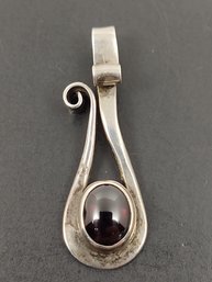 VINTAGE MID CENTURY MODERIST PLUNKETT STERLING SILVER GARNET PENDANT