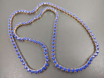 INTERESTING LONG ROSE GOLD TONE BLUE RHINESTONE NECKLACE