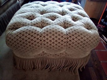 Large Tufted Ottoman With Tassles Around The Base