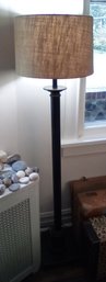 Standing Black Metal Floor Lamp With Broad Tweed Style Lampshade