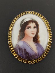 VINTAGE HAND PAINTED WOMAN ON PORCELAIN BROOCH