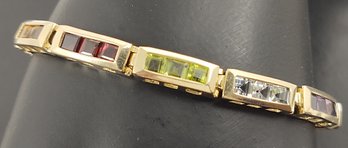 VINTAGE 14K GOLD CHANNEL SET MULTI COLORED GEMSTONE BRACELET