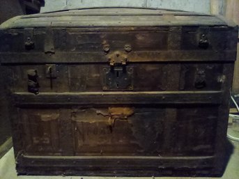 Vintage Wooden Dome Lidded Trunk With Recessed Metal Wheels Underneath