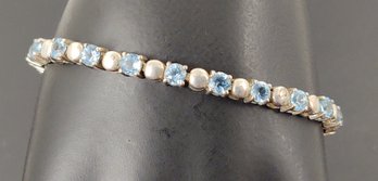 BEAUTIFUL STERLING SILVER BLUE TOPAZ TENNIS BRACELET