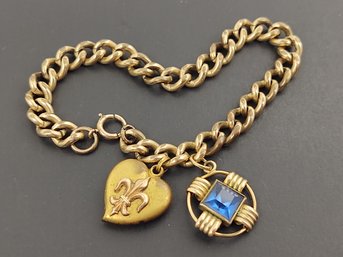 ANTIQUE GOLD FILLED CURB LINK BRACELET WITH TWO CHARMS