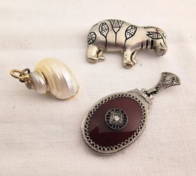 Two Pendants And A Pin