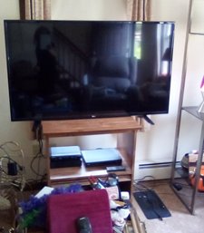 LG Television Model 49LJ510M-UB - Powers Up - Faux Wood Laminate Cabinet Too With Tambour Shelf          LvRm