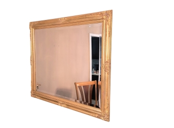 Mirror With Gold Tone Frame And Beveled Glass